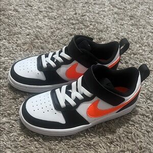 Nike Kids Black and White Sneakers with Orange Accents